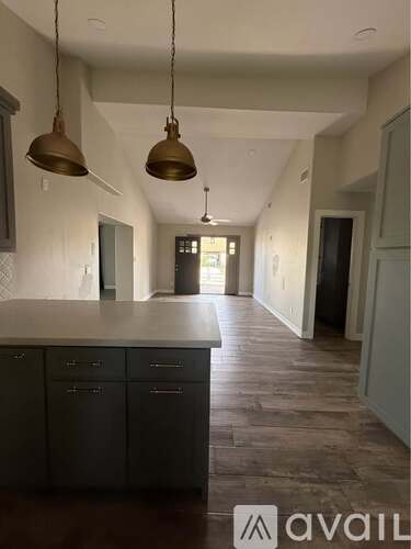 A kitchen with a counter and cabinets.