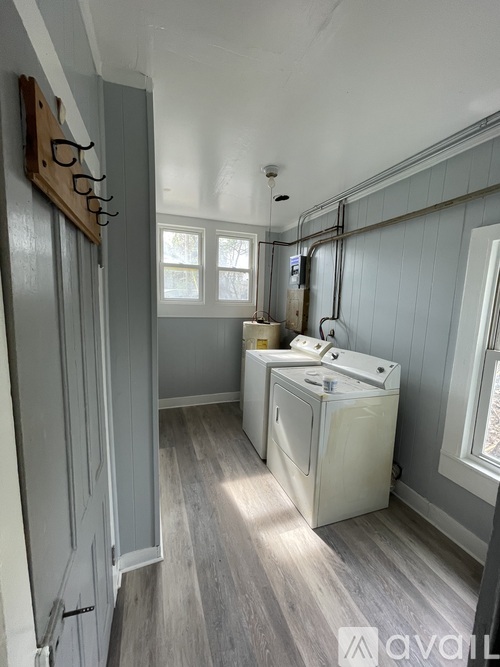 A laundry room with a washer and dryer.