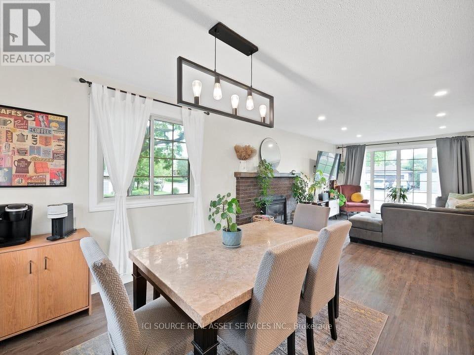 A dining room with a table set for four.