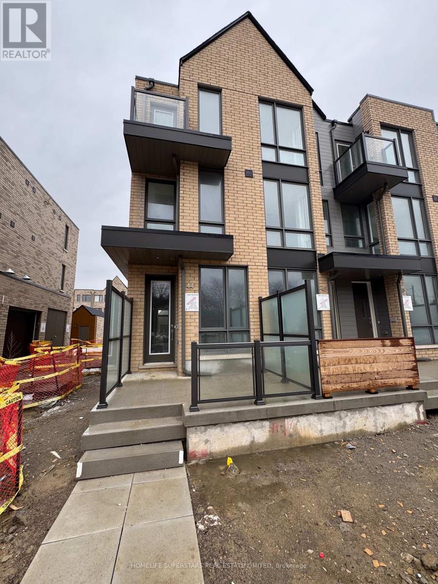 A modern two-story building with glass balconies is for sale.