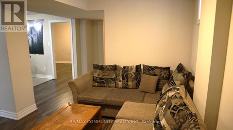 A living room with a couch and a coffee table.