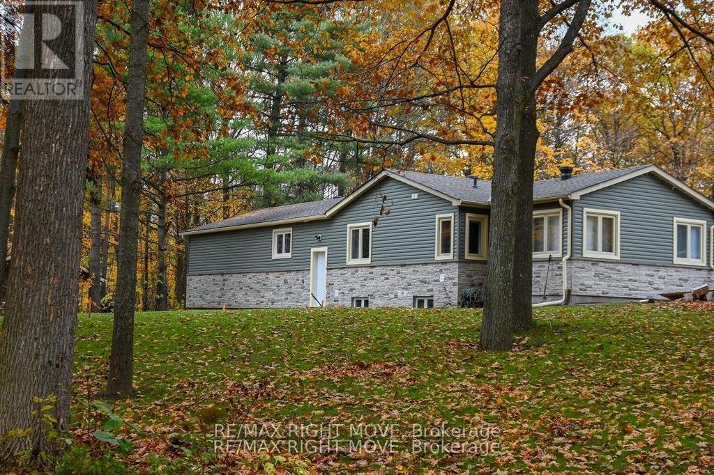 A house with a sign that says REALTOR in the corner.