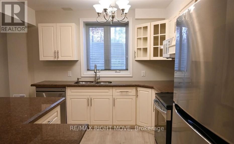 A kitchen with a sink and cabinets.