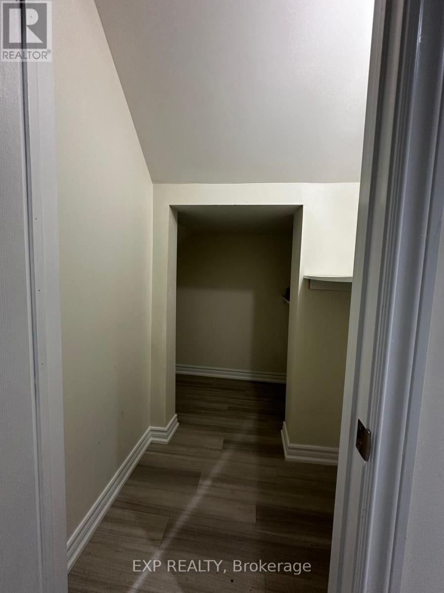 A hallway with a door at the end.
