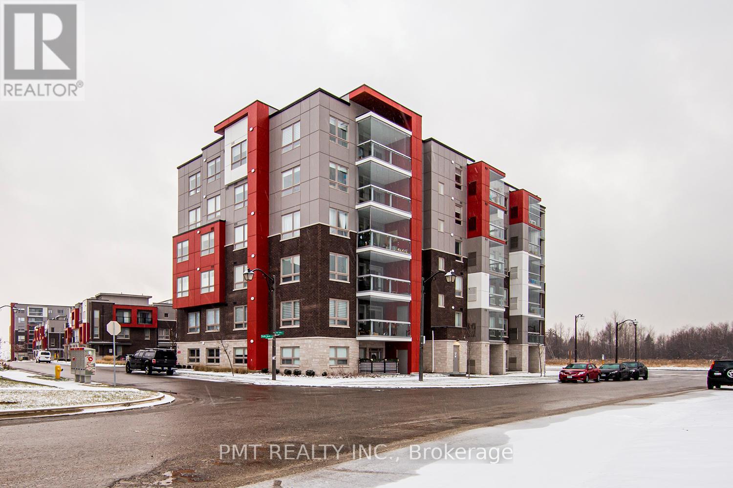 A large red and brown building with the logo "R" on the top left corner.