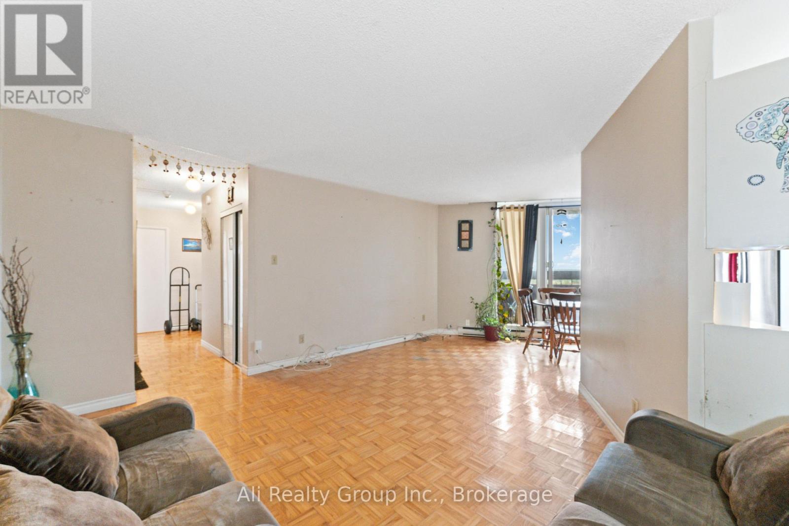 A living room with a couch and a chair.