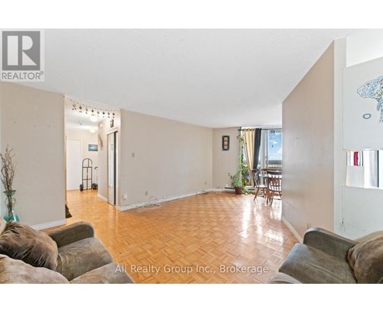 A living room with a couch and a chair.