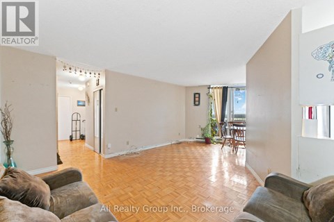 A living room with a couch and a chair.