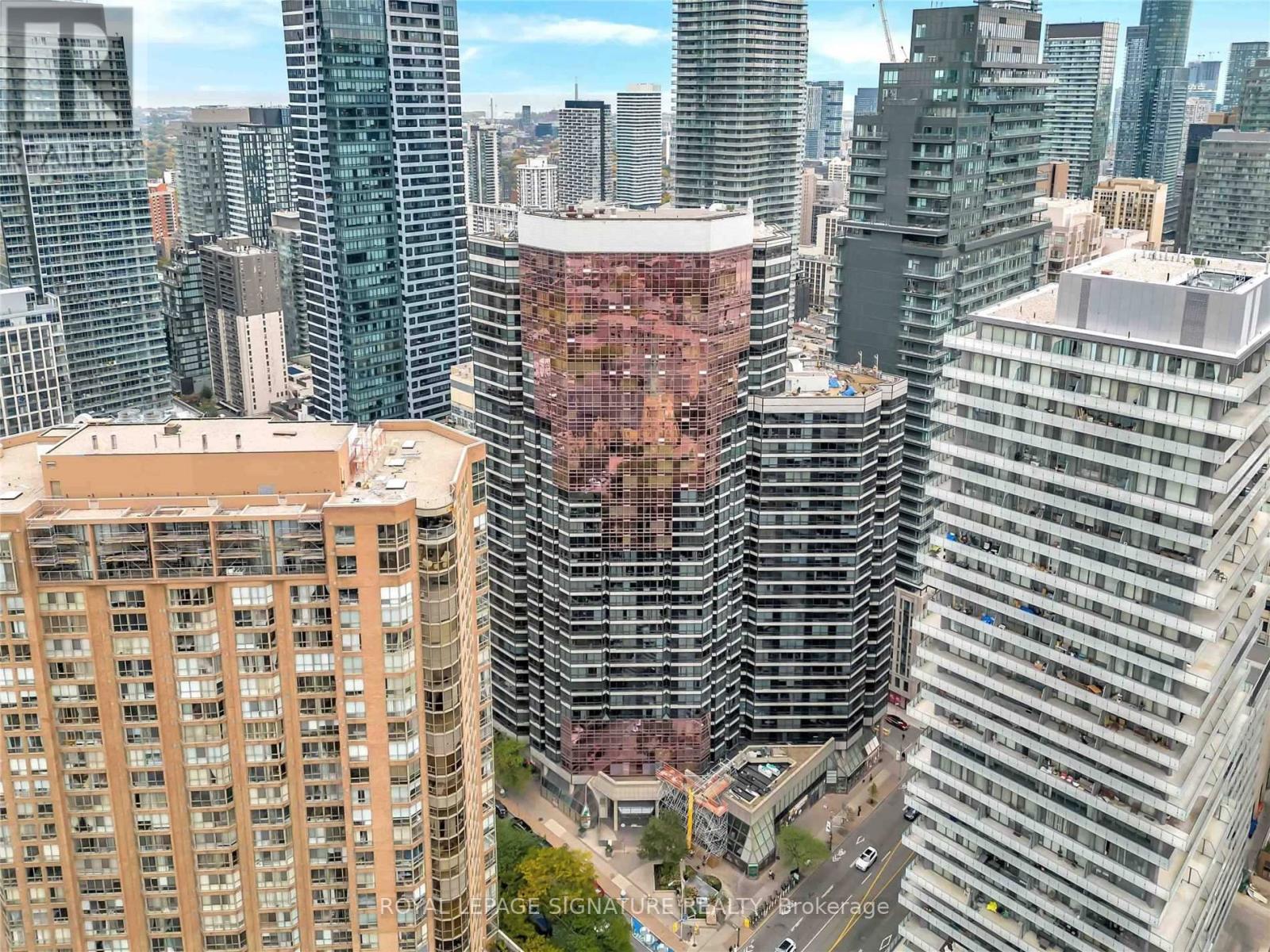 A cityscape with a mix of modern and older buildings.