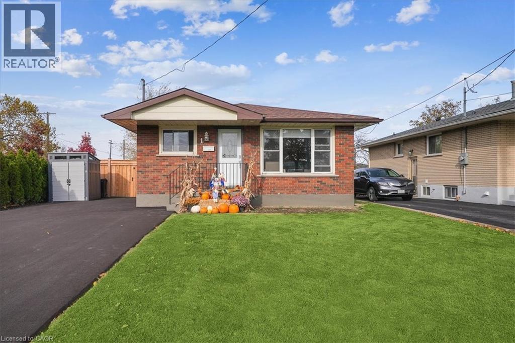 A house with a lawn in front of it is for sale.