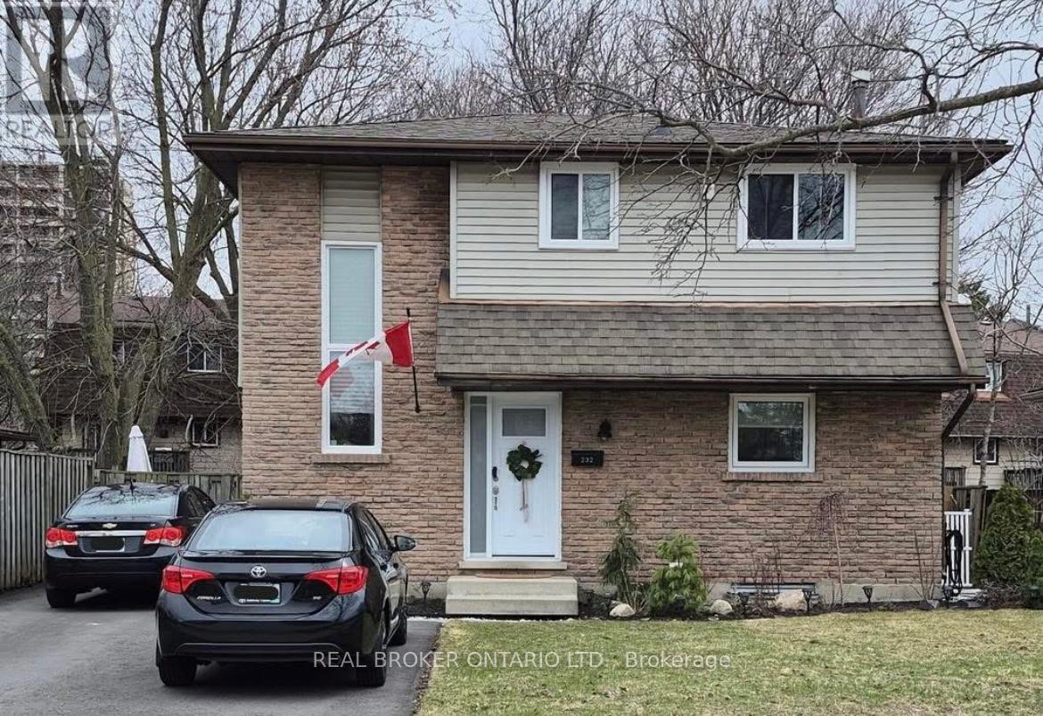 A house with a car parked in front of it.