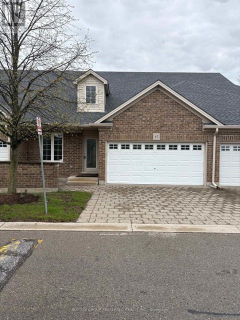 A brick house with a white garage door.