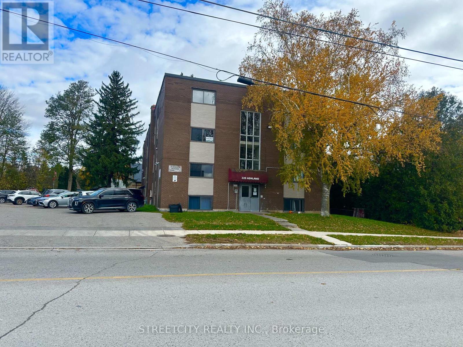 A building with a parking lot in front of it.