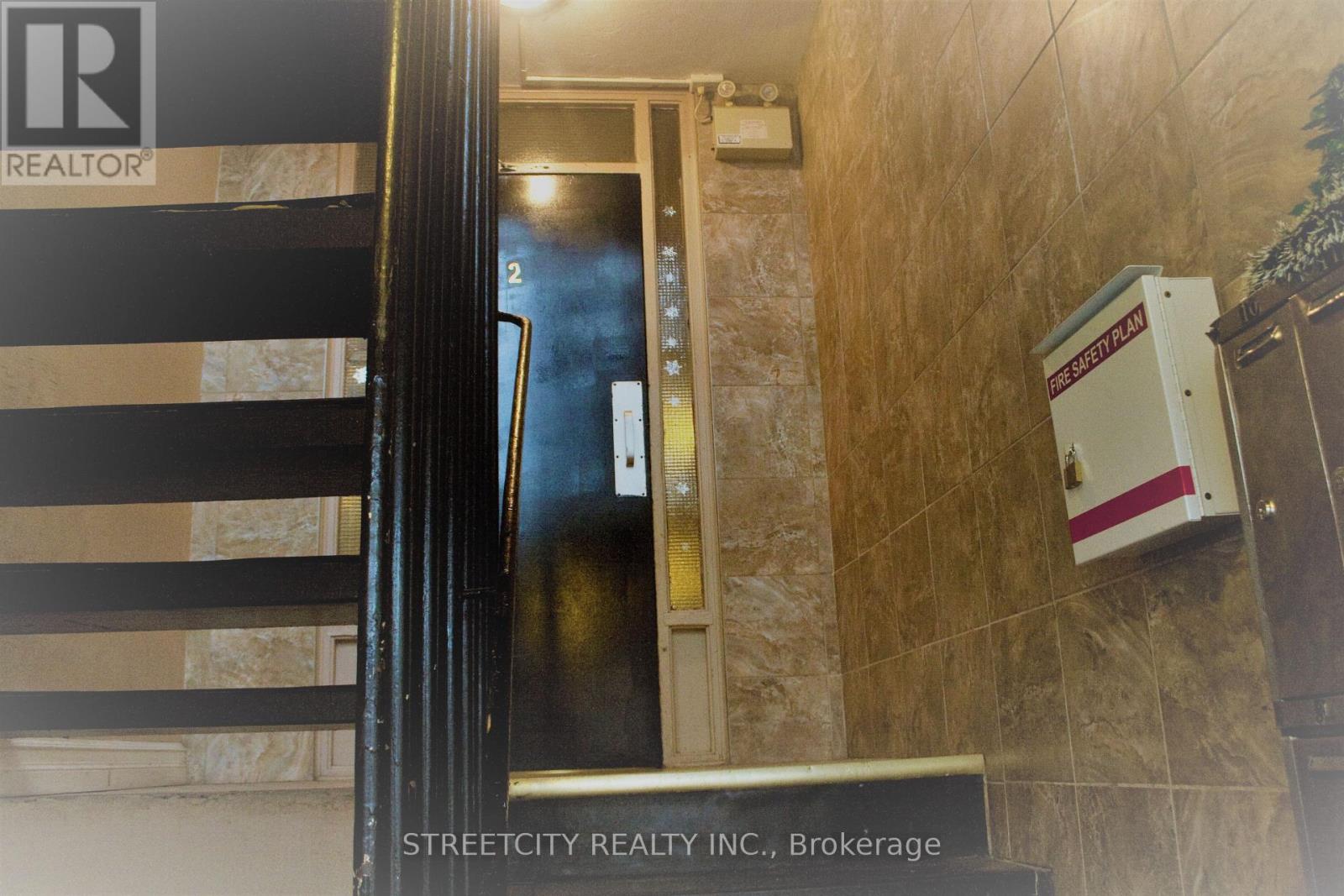 A sign for Streetcity Realty Inc. is on the wall.