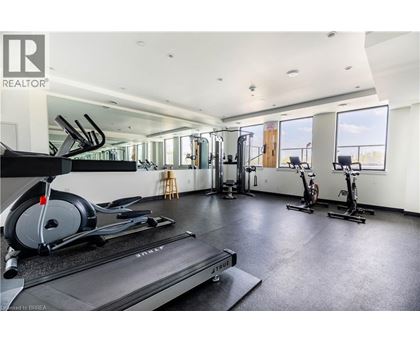 A gym with treadmills, elliptical machines, and stationary bikes.