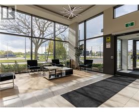 A waiting area with a glass wall and a view of the outside.