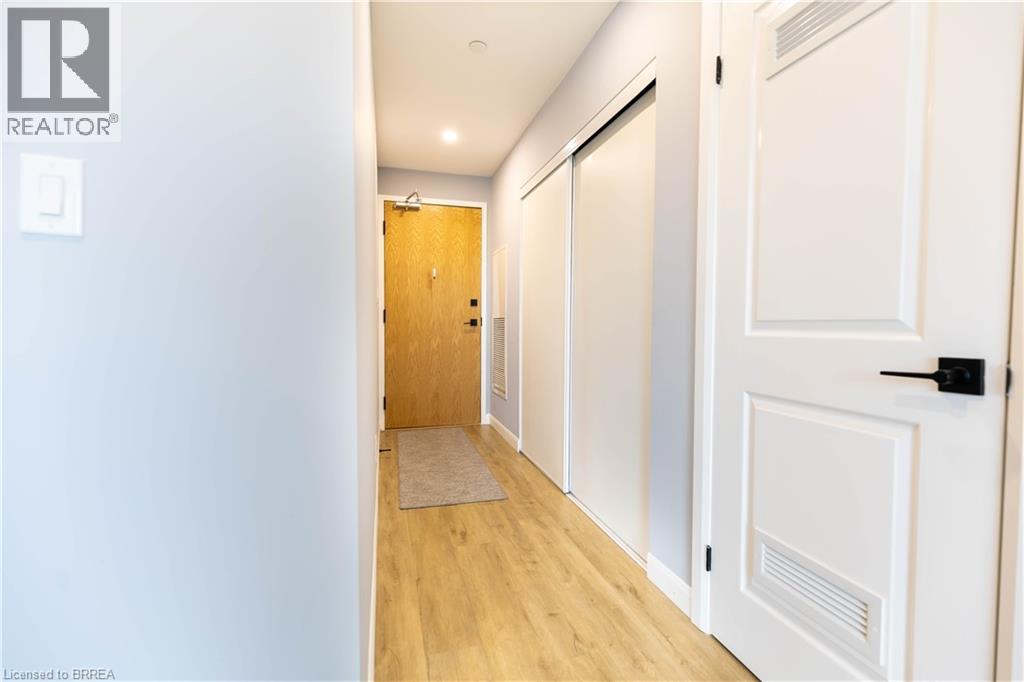 A hallway with a door on the right and a door on the left.