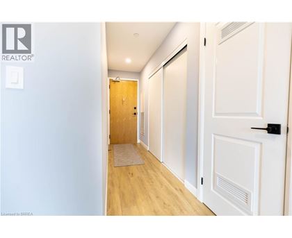 A hallway with a door on the right and a door on the left.
