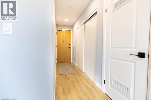 A hallway with a door on the right and a door on the left.