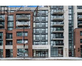 The Charlotte building is a modern structure with a combination of glass and brick.