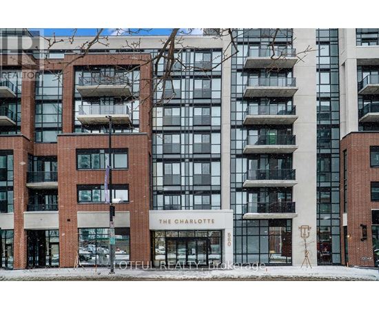 The Charlotte building is a modern structure with a combination of glass and brick.