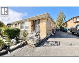 A house with a boarded up window is for sale.