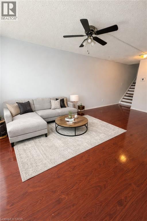 A living room with a grey couch and a coffee table.