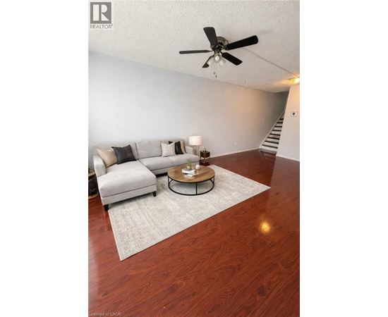 A living room with a grey couch and a coffee table.