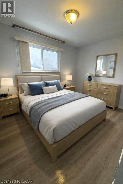 A bedroom with a bed, nightstands, and a window.