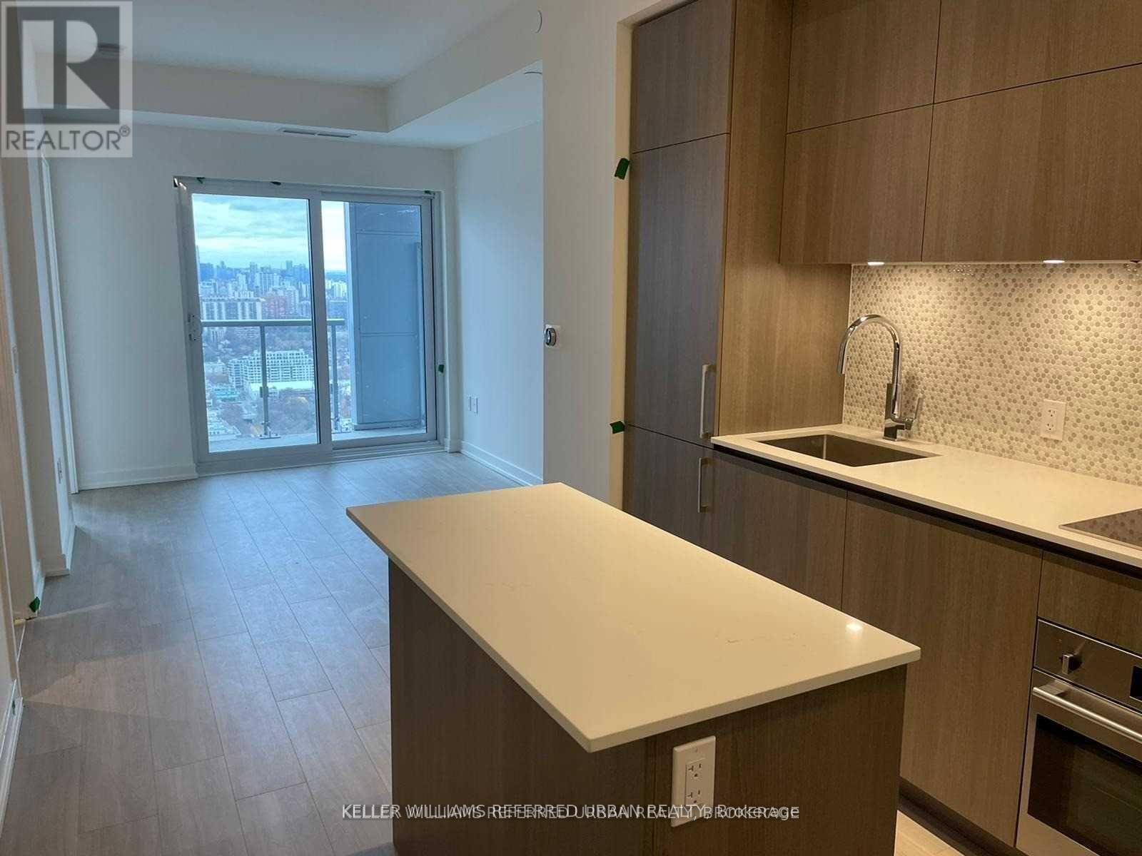 A kitchen with a countertop and cabinets.
