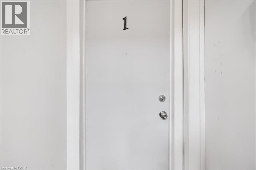A white door with a number 1 on it.