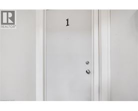 A white door with a number 1 on it.