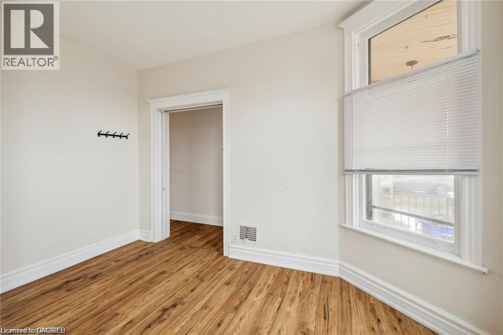 A room with a window and a door.