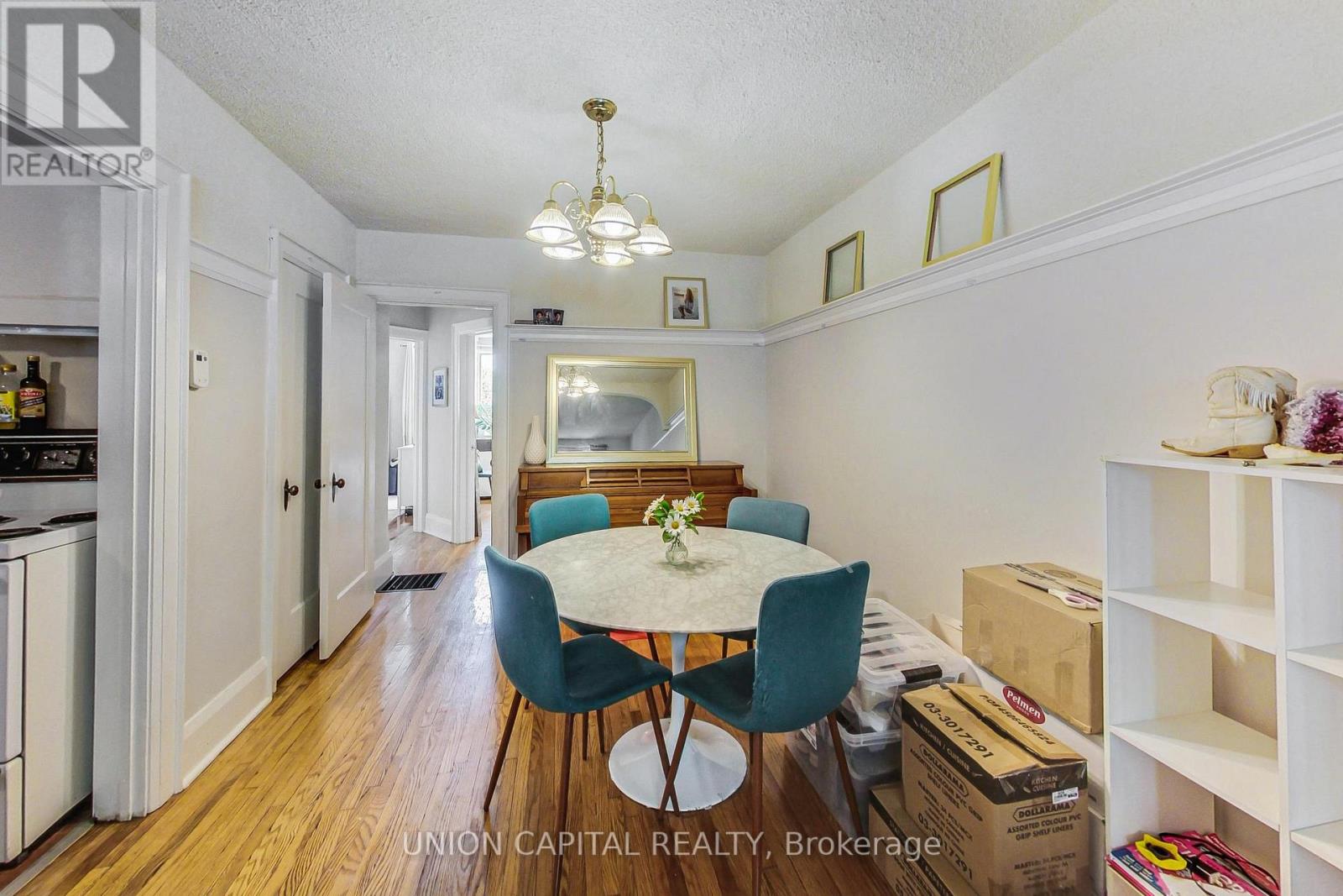 A dining room with a table and chairs is shown.