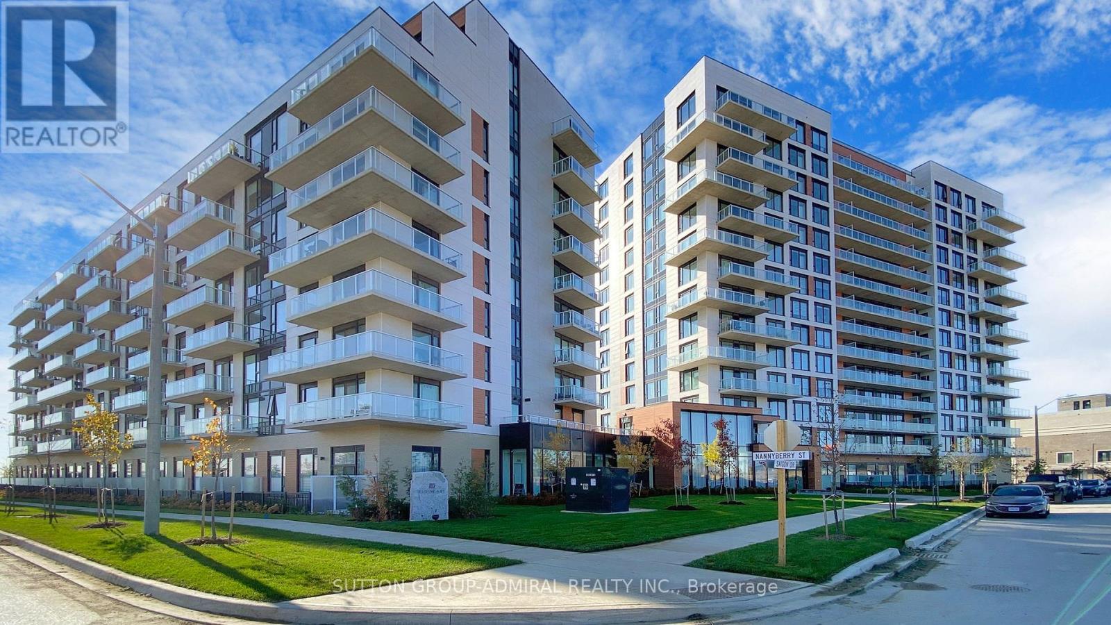 A large apartment complex with a sign that says REALTOR.
