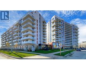A large apartment complex with a sign that says REALTOR.