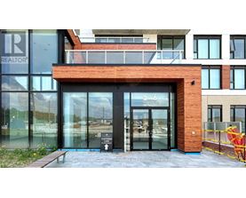 The entrance to a building with a glass door and a sign that reads "REALTOR".