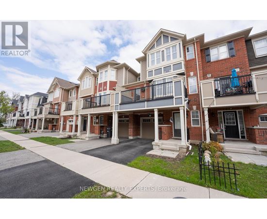 A row of townhouses with balconies and a sign that says Newgen Realty Experts Brokerage.