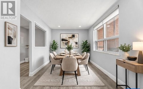 A dining room with a table set for six.