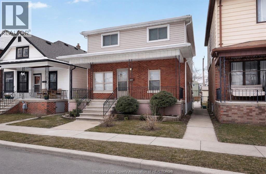 A house with a red brick facade is shown in the image.