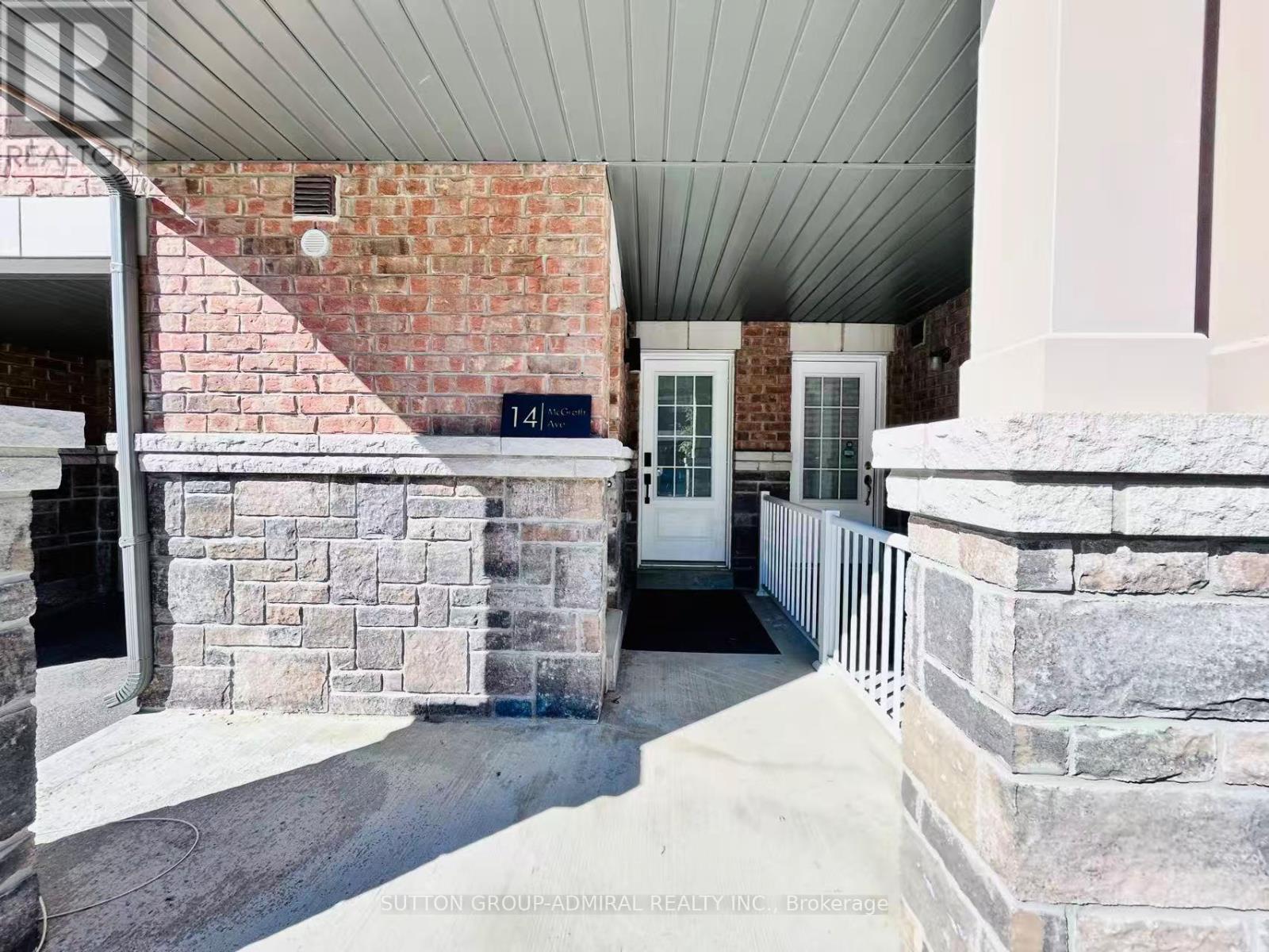 A house entrance with a number 14 on the wall.
