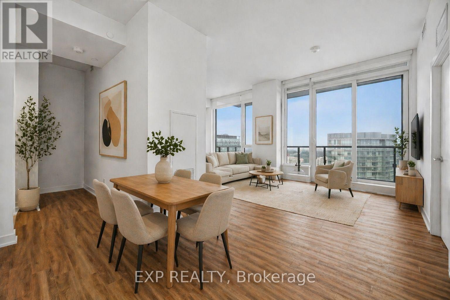 A dining room with a wooden table and chairs.