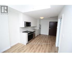 A kitchen area with a counter and a microwave.