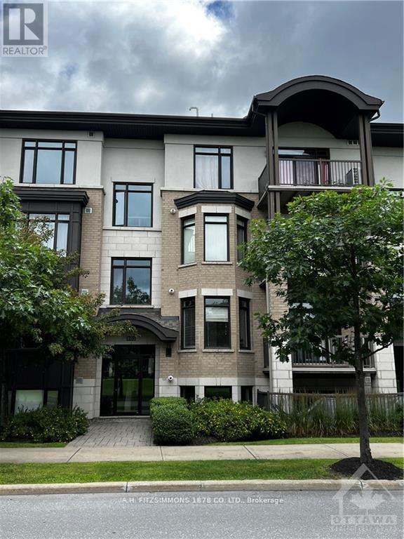 A large, multi-story residential building with a balcony on the second floor.