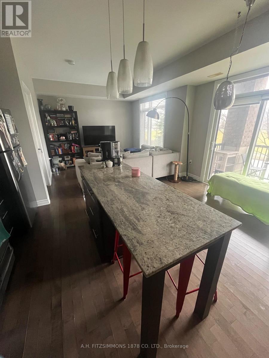 A kitchen with a table in the middle of it.