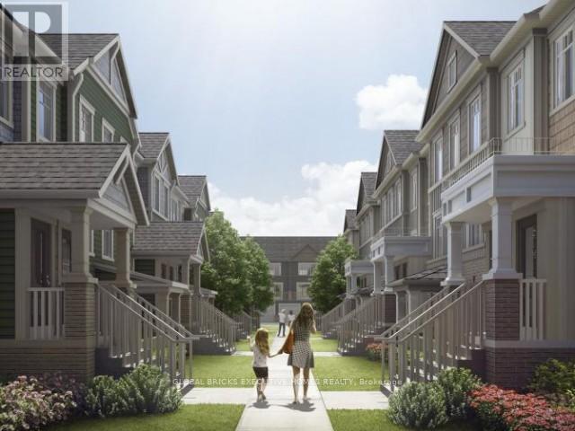 A woman and a child are walking down a path in a residential area.