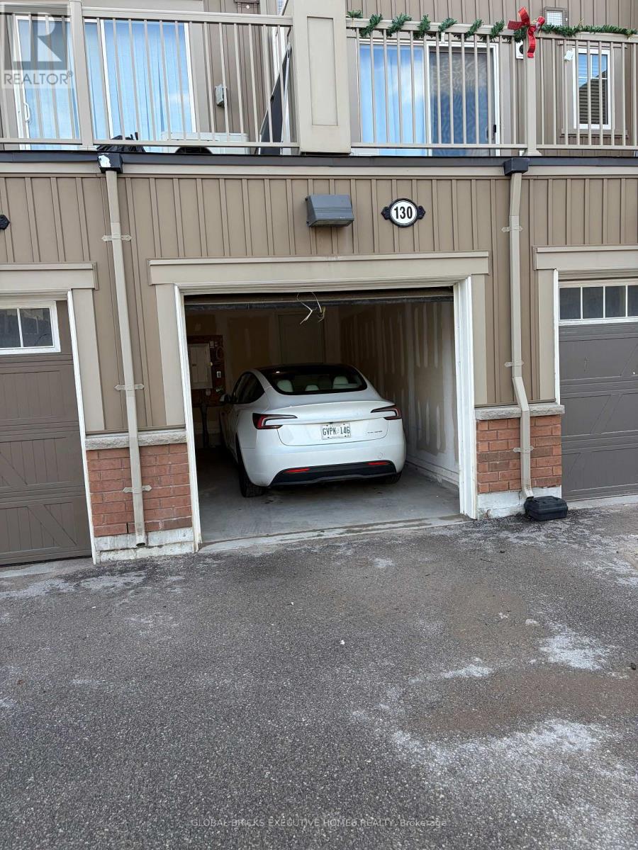 A car is parked in a garage entrance.