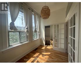 A sunny room with a window and a door.