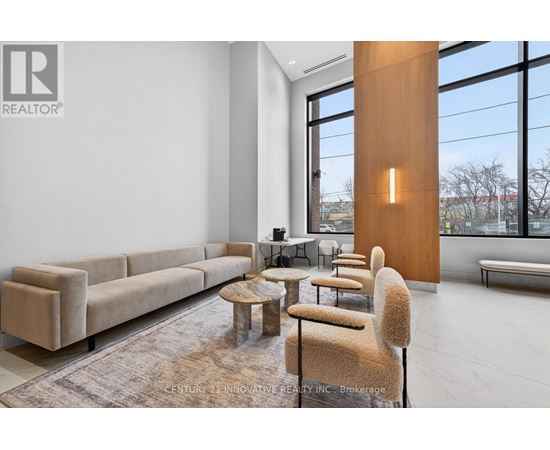 A modern living room with a large window and a long couch.