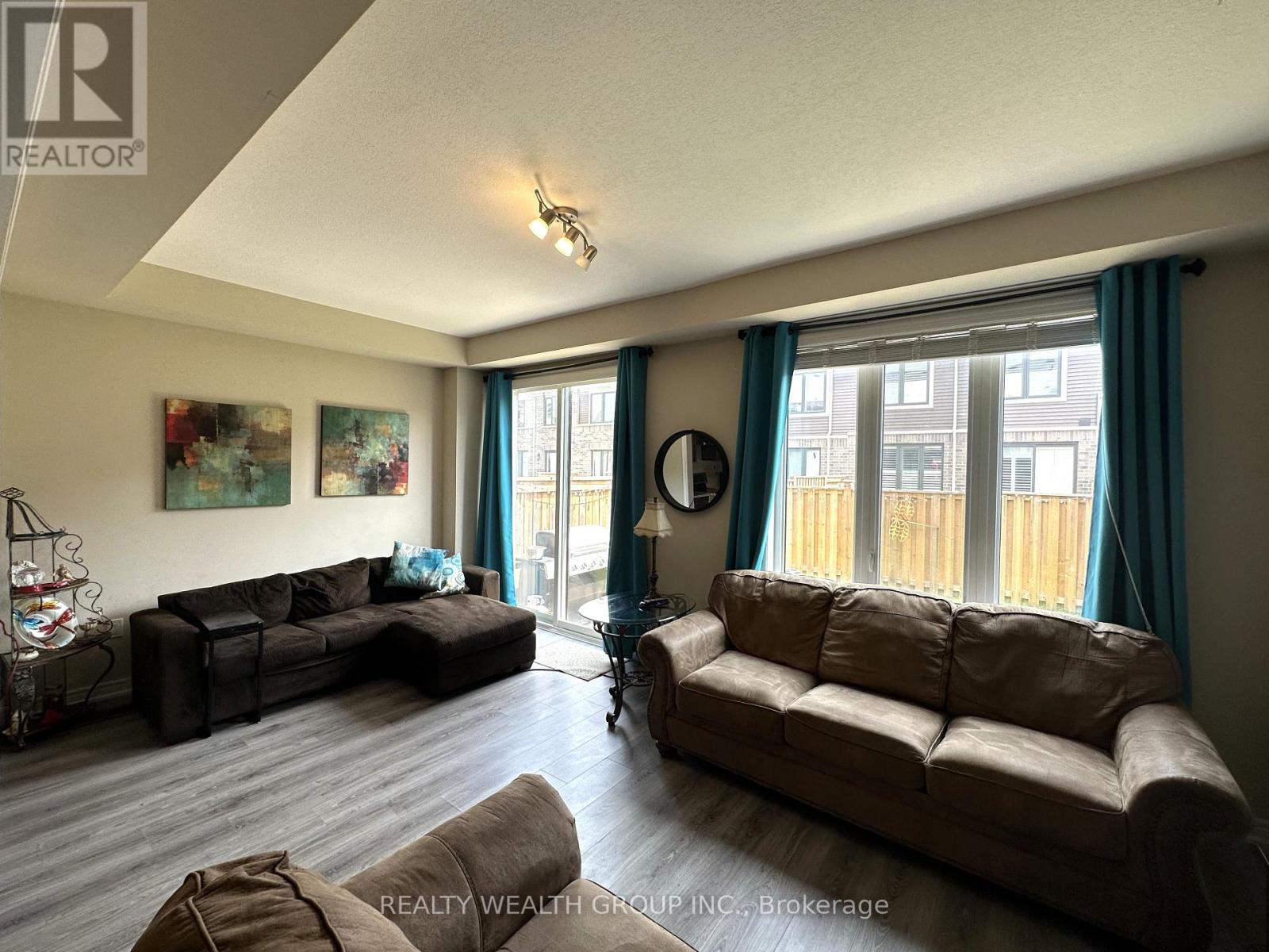 A living room with two couches and a fishbowl on the table.